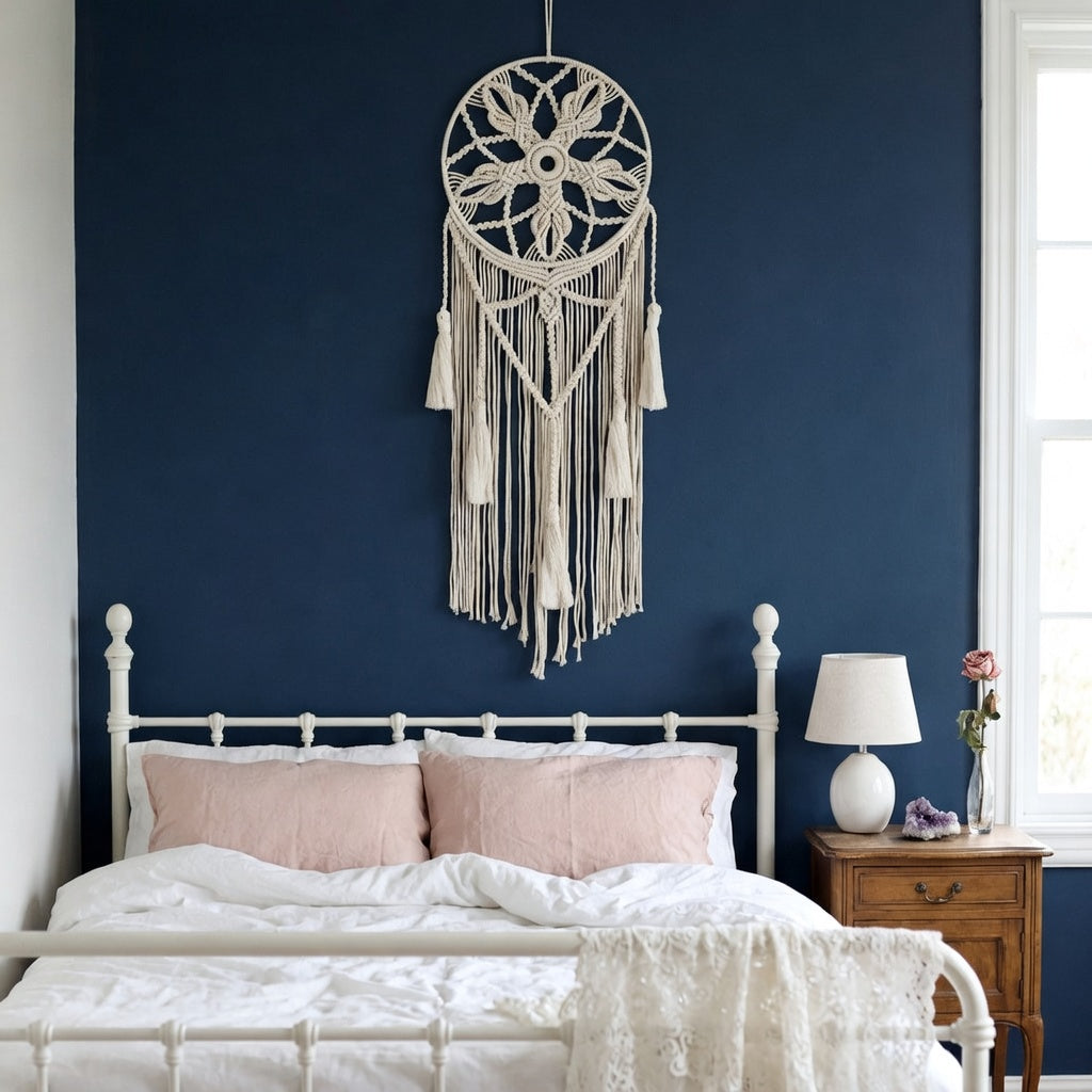 Cream macrame dreamcatcher with cotton tassels on terracotta wall in minimalist Japandi bedroom — Bohoartis