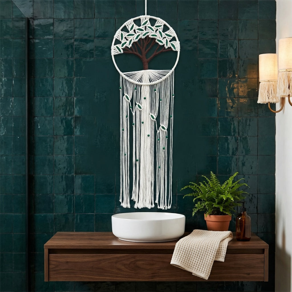 Tree of life macrame wall hanging in boho bathroom, green leaf fringe variant on dark teal wall, cotton rope decor