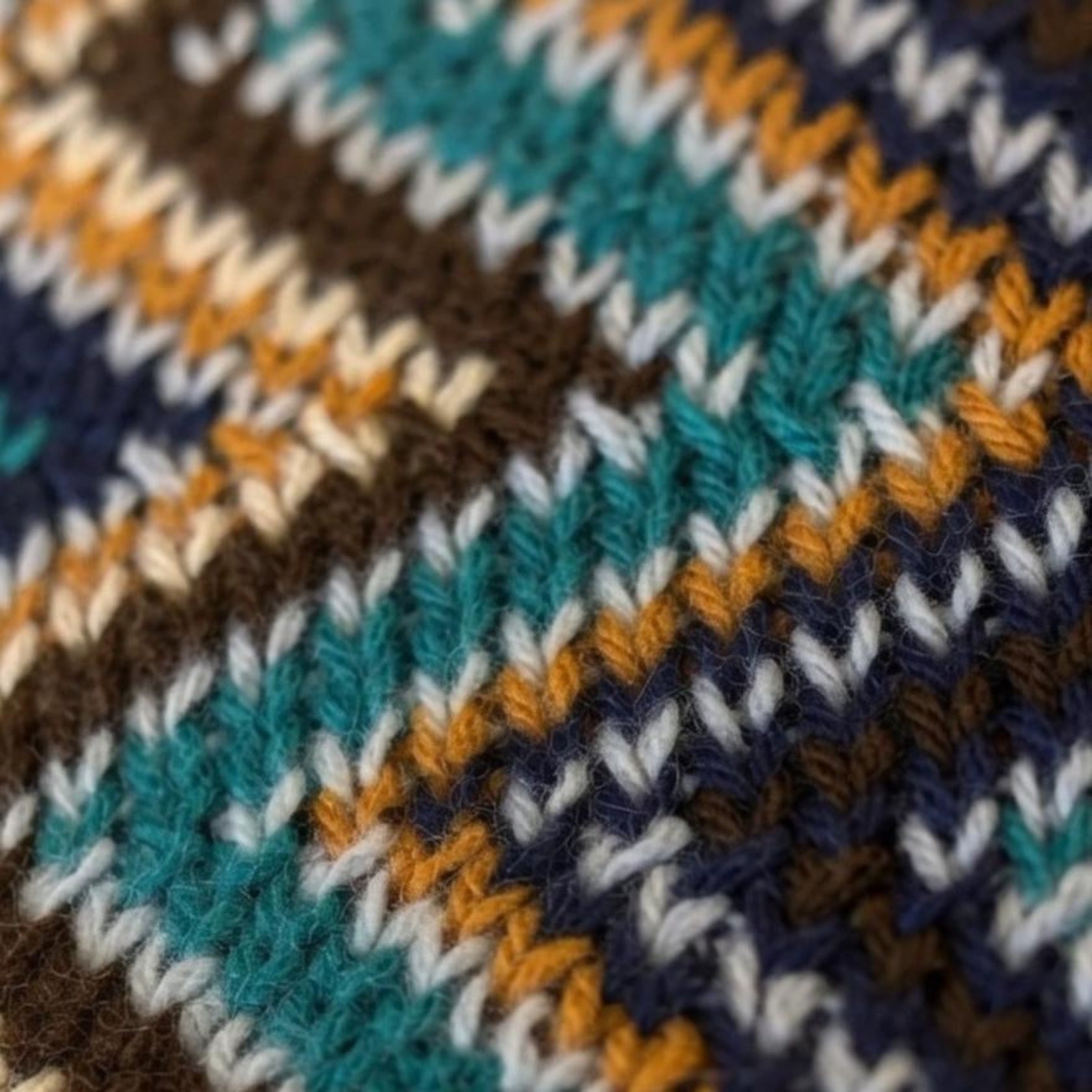 Flat lay of zigzag woven blanket showing chevron stripe pattern detail