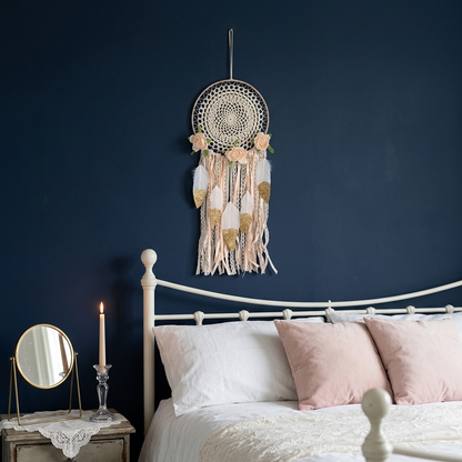 Boho lace flower dreamcatcher with gold glitter hearts on navy blue wall in romantic bedroom decor