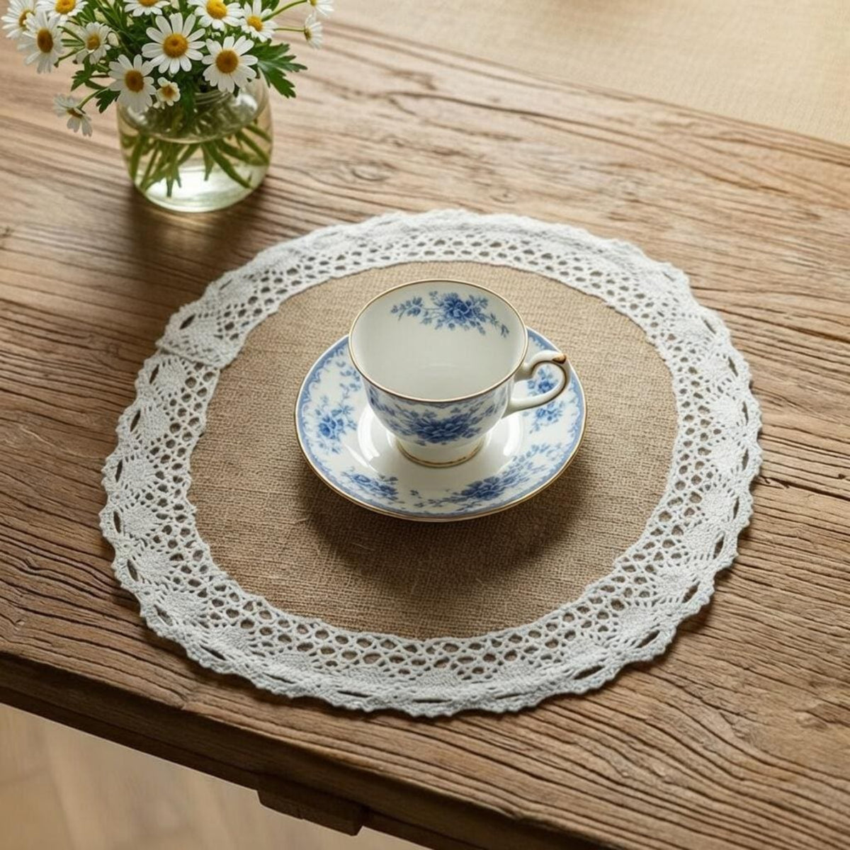 Round burlap placemat with crochet lace edge under teacup on wood table