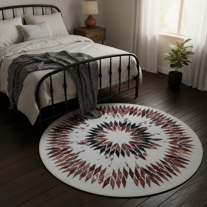 Geometric circle rug — wine and burgundy starburst pattern