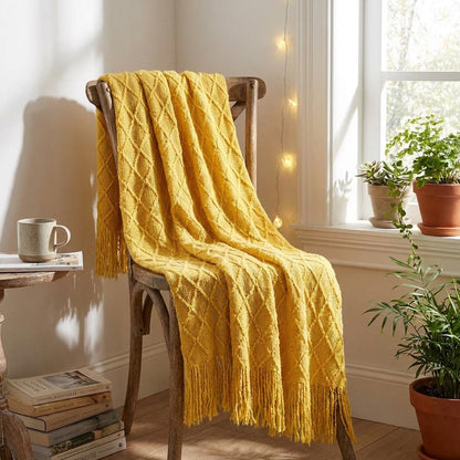 Knit tassel throw blanket — plaid texture detail