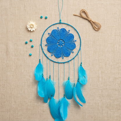 Blue dream catcher with turquoise feathers flat lay on linen — dreamcatcher gift idea