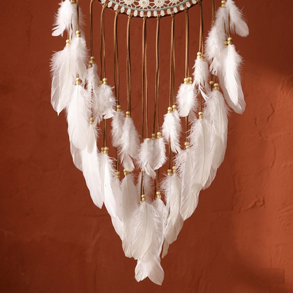 Large mandala dreamcatcher — close-up of white feather fringe with gold wooden beads on suede cords