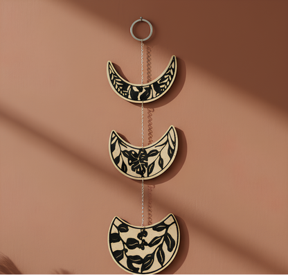 Moon phase lunar cycle garland with metal chain links and black botanical pattern on ivory discs