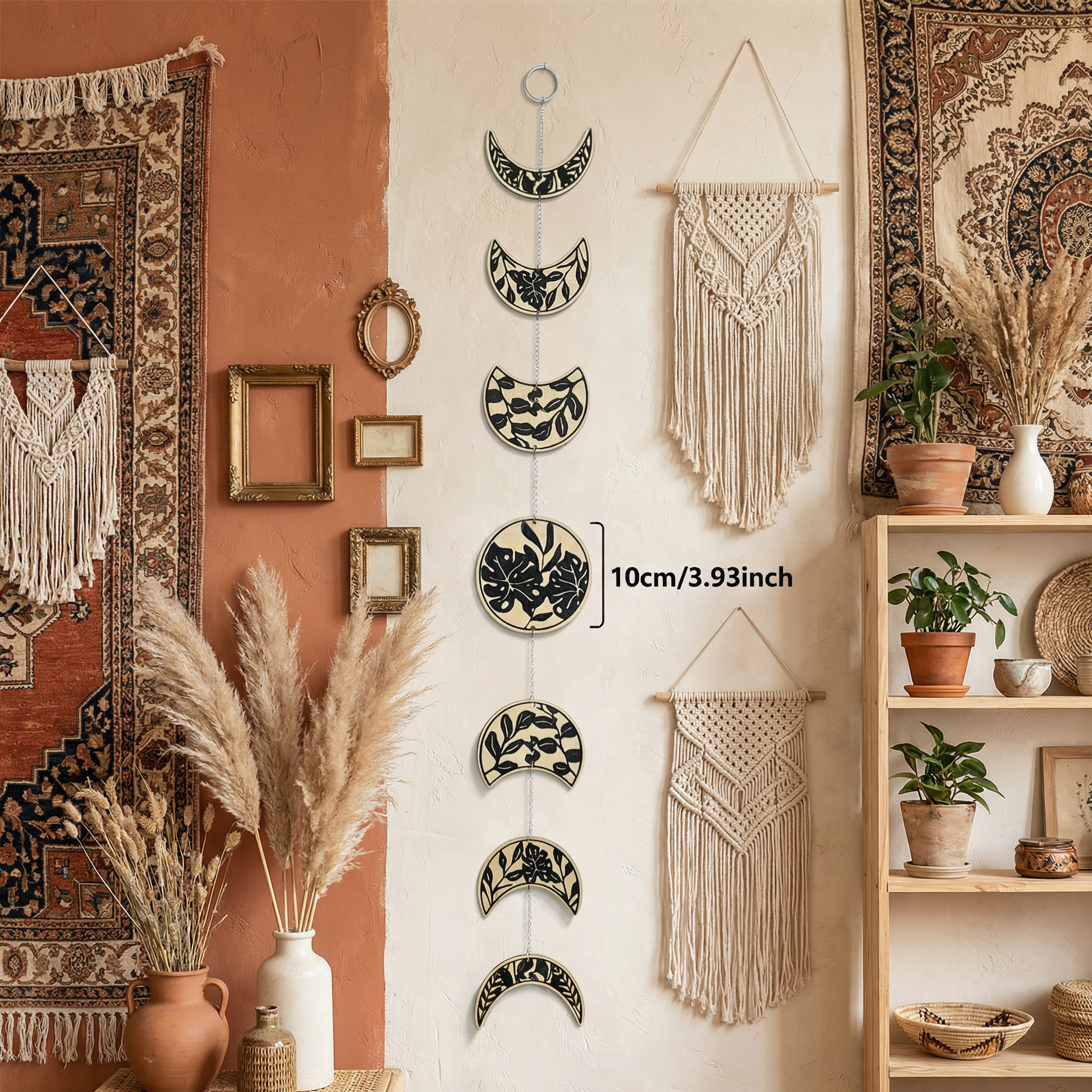 Moon phase wall hanging near dried pampas grass and window in earthy boho living room
