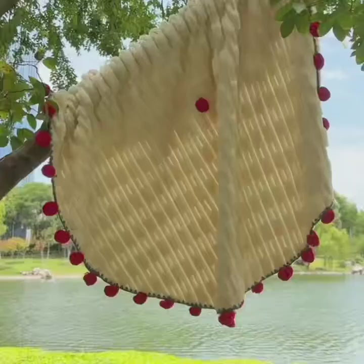 Video of rose bouquet throw blanket unfolding from bouquet into full round floral fleece — soft 3D rose border detail