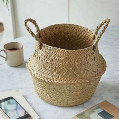 Video of Handwoven seagrass belly basket on marble table coastal boho storage organizer
