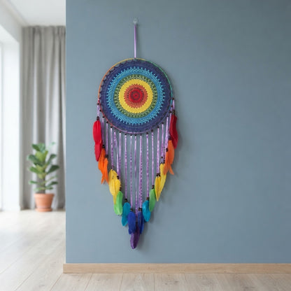 Rainbow dreamcatcher on dusty blue wall, Scandinavian boho bedroom wall decor with crochet mandala and feathers