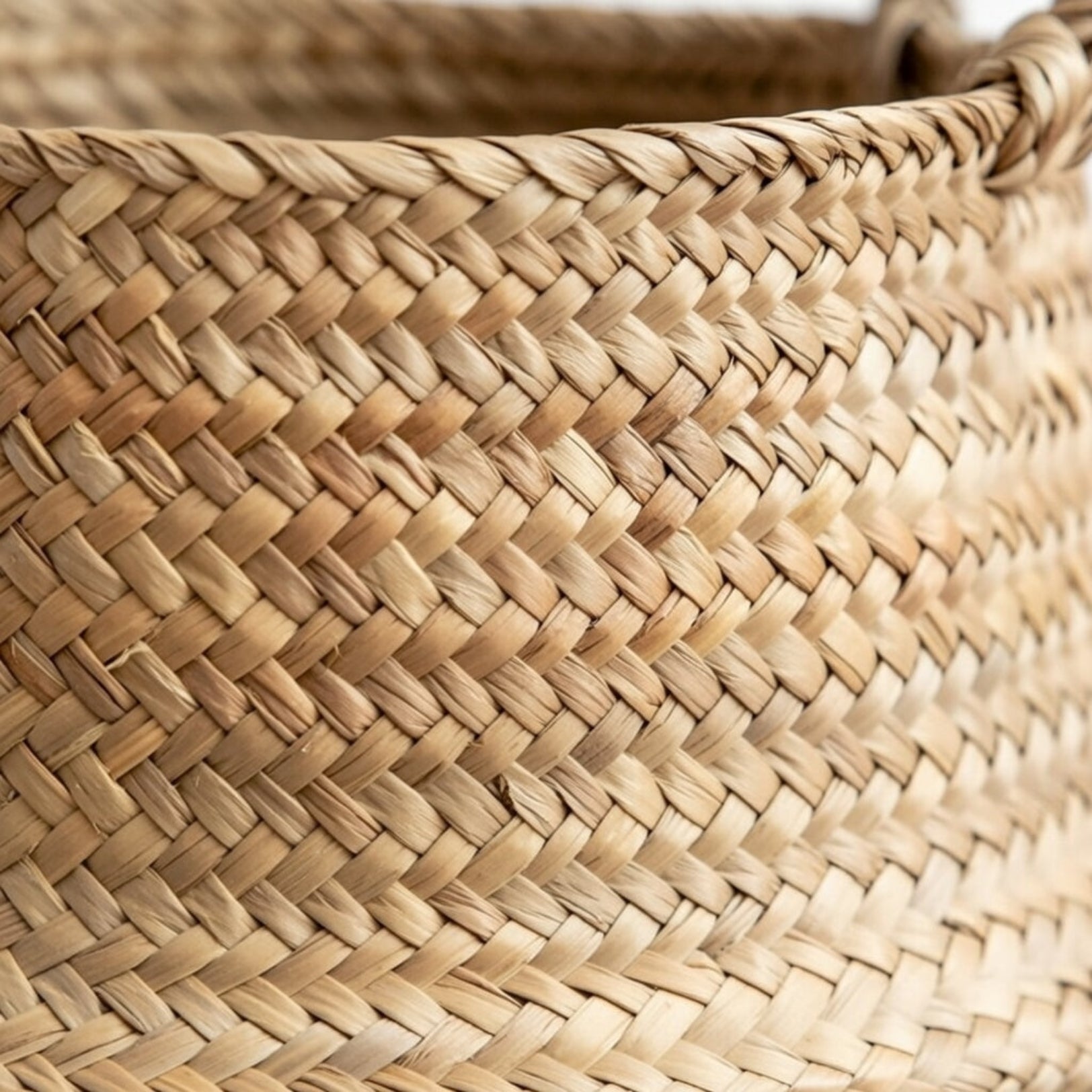 Close up seagrass weave texture handwoven natural fiber belly basket detail