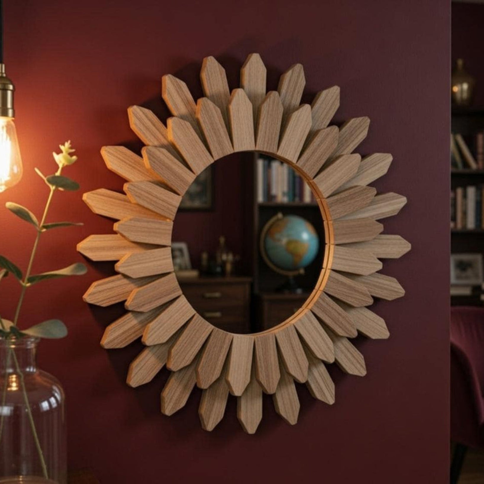 Round wood sunflower mirror catching warm light — boho farmhouse wall decor for entryway or hallway