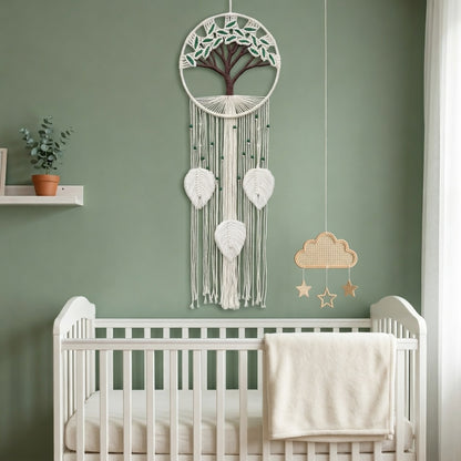 Tree of life macrame wall hanging in boho nursery above white crib, sage green wall, nature cotton rope baby room decor